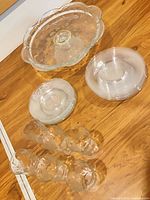 Entire lot: cake stand, dessert plates in two stacks, six grape tumblers