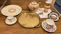 Group view of all porcelain pieces and tray