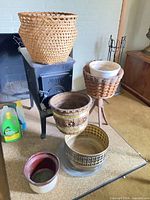 Group view of all baskets and planters on hearth