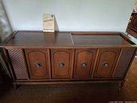 Full view of Magnavox wooden console stereo cabinet