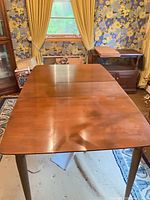 Dining table with leaf inserted, full top view