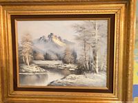 Full view of framed oil painting showing landscape scene