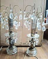 Full view of both matching crystal boudoir lamps showing overall design and condition