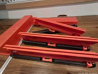 Three folded warning triangles and storage case