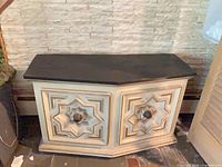 Full view of side table front showing design and slate top