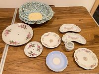 Group shot of all eight porcelain pieces on table