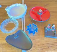 Group shot showing all six ashtrays on table