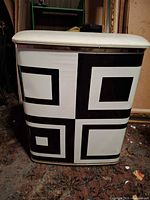 Front view showing geometric pattern and padded lid