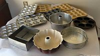 All bakeware pieces laid out on table