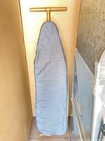 Front view of ironing board with blue cover