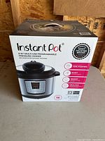Front of sealed Instant Pot IP-LUX80 retail box showing product image and specifications