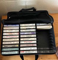 Open carrying case displaying all 18 jazz and big-band cassettes