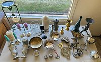 overview of all mixed metal decorative items on table