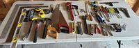 Full view of all hand tools laid out on tables
