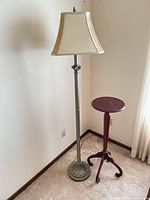 Full view of metal floor lamp and mahogany pedestal stand