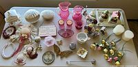 Overall view of all decorative glass, porcelain, textiles and accessories on tabletop