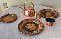 Group shot displaying all seven copper items