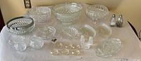 Full lot overview displaying all cut glass pieces on table