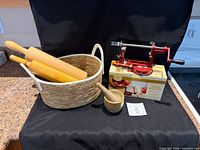 Group shot showing apple peeler, two rolling pins, mortar with pestle and basket
