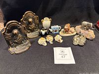 Overall lot showing bookends, vase, assorted figurines and Wade items