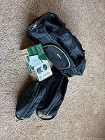 All four items grouped: OGIO duffle, Nike toiletry bag, Eddie Bauer toiletry bag, Woods lantern box