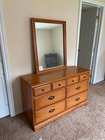 dresser with mirror on top