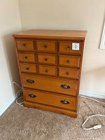 Front view of Baronet tallboy dresser showing drawer arrangement and hardware