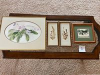 All four framed artworks laid out together
