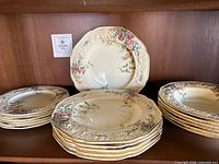 Stacked plates and bowls showing quantity and pattern