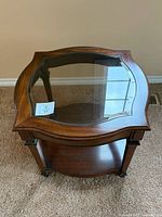 Full view of glass top wood end table showing overall design