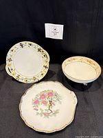 Overview of three Nippon porcelain pieces: handled plate, footed bowl, scalloped plate