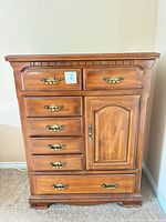 Front view of Kroehler dresser showing drawers, door and hardware