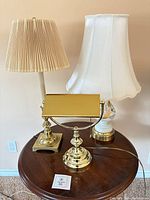 Three lamps on table showing overall condition and style