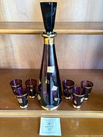 Full set showing decanter with stopper and six tumblers