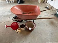 All items: wheelbarrow, watering can, planters, pots