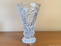 Full frontal view of crystal vase showing pinwheel and diamond cuts