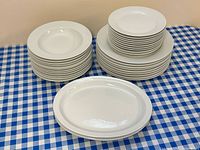Full set arranged in three stacks: bowls, plates, platters