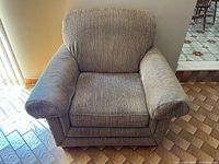 Front view of La-Z-Boy armchair showing overall form, cushions and rolled arms