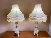 Full view of both matching table lamps on surface