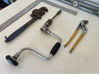 All five vintage tools arranged on table