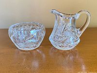 Side view of pinwheel-cut sugar bowl and creamer
