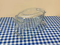 Stacked oval covered casserole on rectangular dish