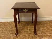 Front view showing faux drawer hardware and cabriole legs