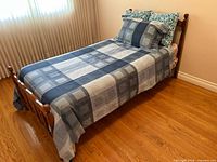 Full view of assembled bed with duvet, sham and accent pillows