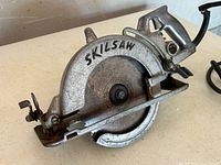 Left-side view of Skil 77C saw showing housing, blade guard, handle
