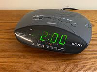 Front view showing Sony ICF-C215 Dream Machine with green LED display at 2:00