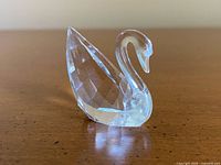 Left profile view of faceted crystal swan