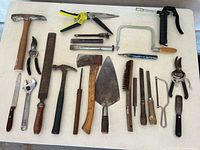 Overall view of all hand tools laid out on table