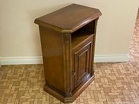 Full view of wooden console cabinet front and side