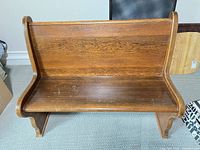 Front view of solid wood church pew bench